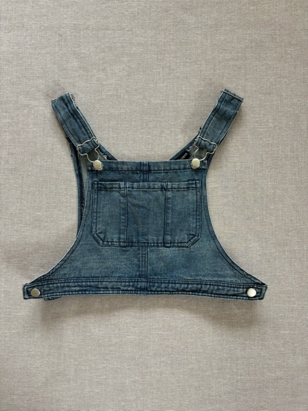 Cotton Express denim overall cropped vest.